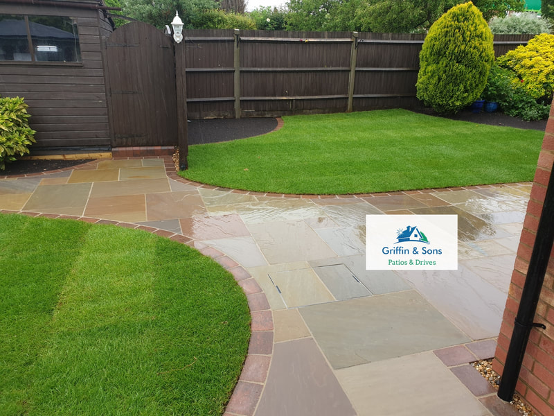 Forest Glen Indian Sandstone Patio finished with a Brindle Alpha paving brick and freshly laid turf
