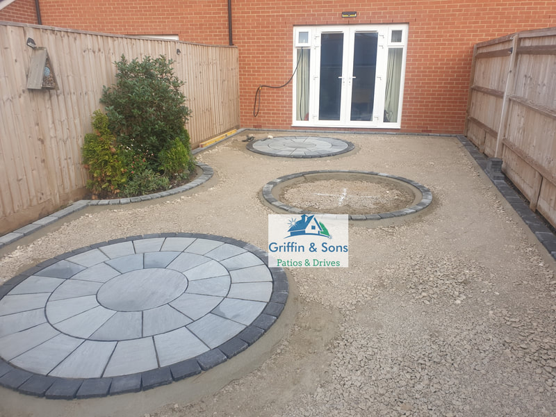 Kandla Grey/Mountain Mist Indian Sandstone Patio with Circle Packs and Charcoal Brick Edging 