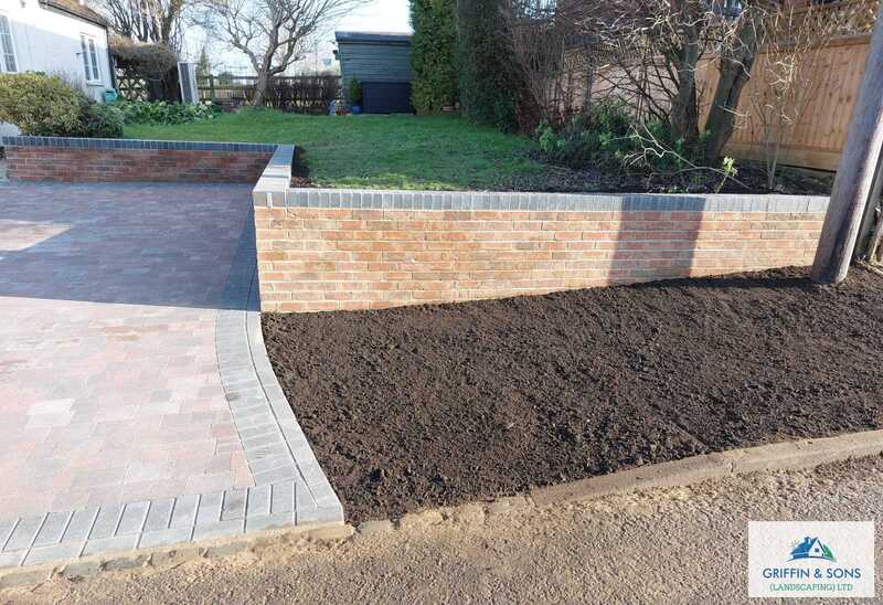 Block paved driveway border
Brick wall